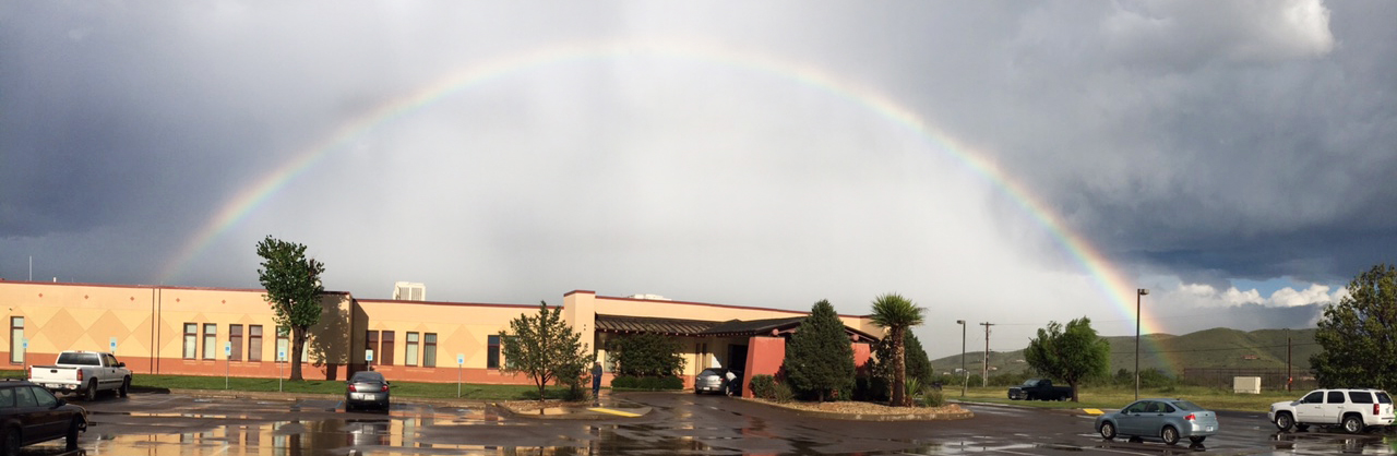 Rainbow over the exterior of Big Bend Regional Health Center building.
